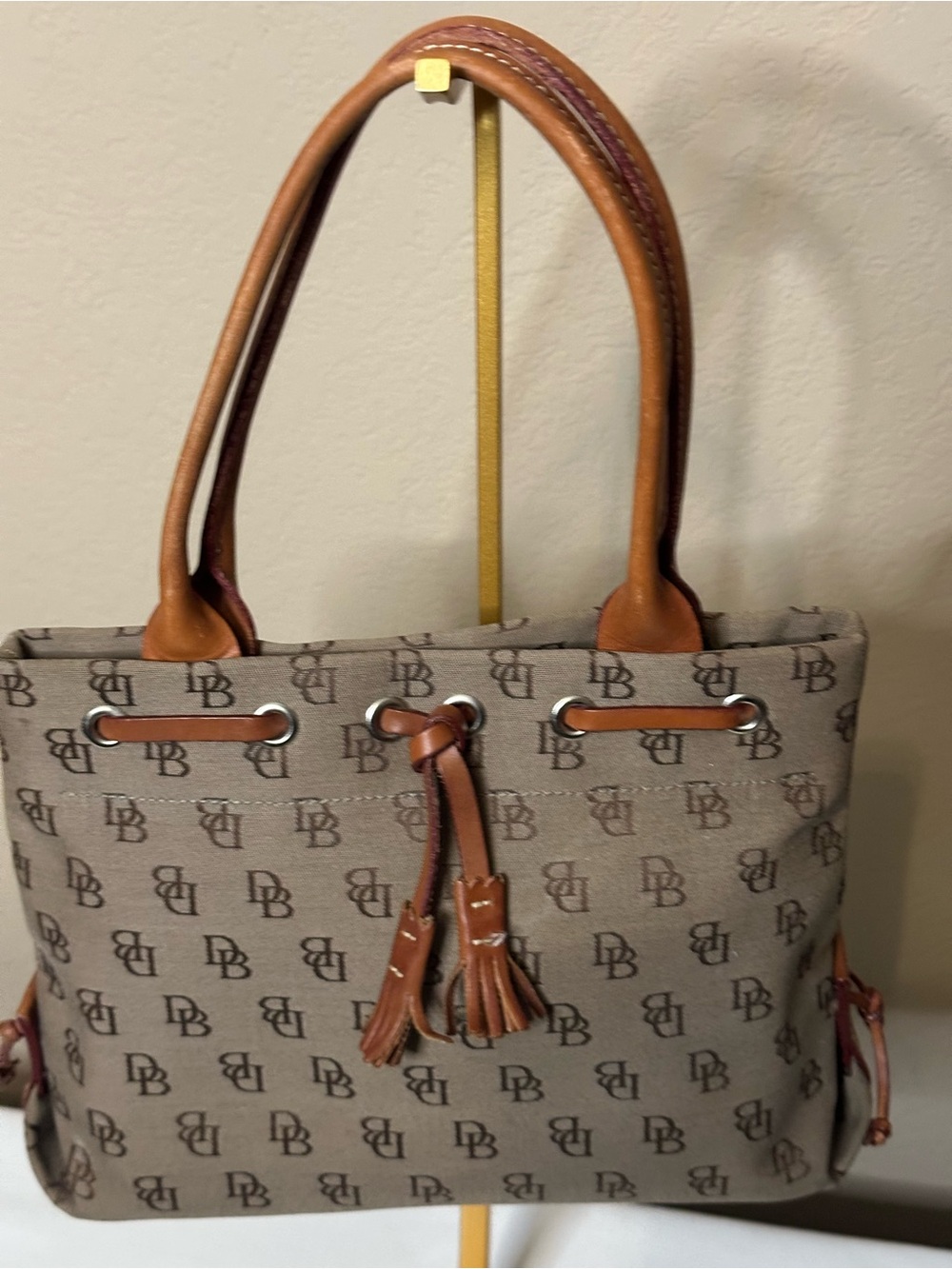 Vintage Dooney & Bourke Tassle Small Tote Bag in Brown.  Small white spots shown
